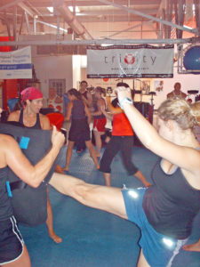 Nathan Nowak teaching an Are You Prepared? women's self defense and kickboxing class at Trinity Fitness in Atlanta Goergia