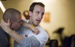 Nathan Nowak demonstrating self defense techniques at are you prepared women's self defense seminar